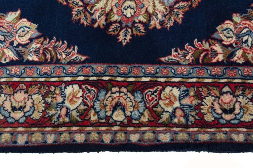 Corner detail of 2000s Sarough rug showing border pattern and Wool pile