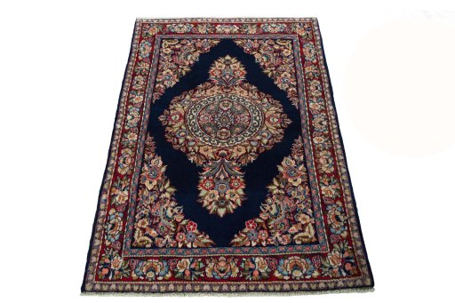 Surface texture of 2000s Sarough rug with natural Wool and intricate pattern