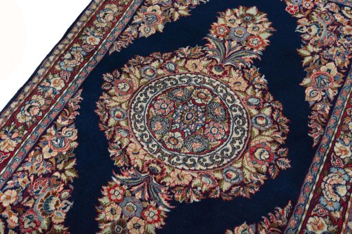 Backside of handmade 2000s Sarough rug showing knot structure and weave density