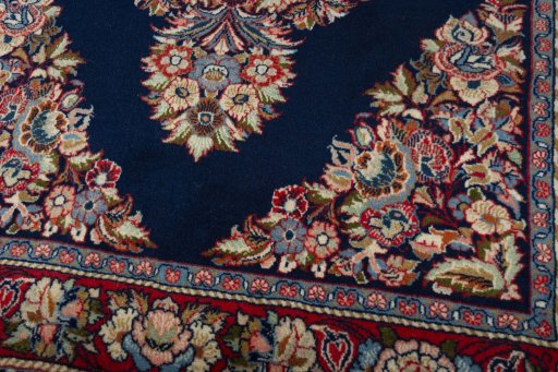 Close-up detail of 2000s Sarough rug from Iran / Persia showing Wool weave