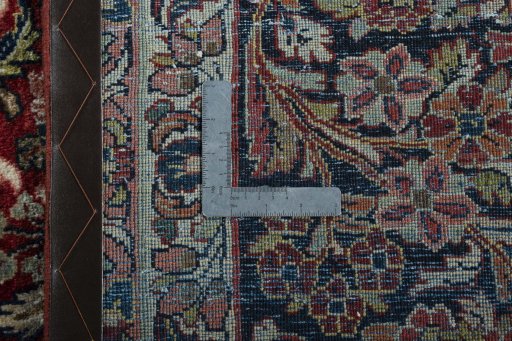 Backside of handmade 1950s Sarough rug showing knot structure and weave density