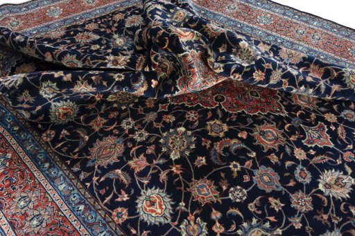 Surface texture of 2000s Sarough rug with natural Wool and intricate pattern