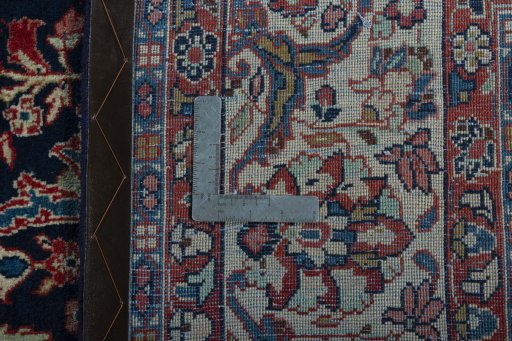 Backside of handmade 1970s Sarough rug showing knot structure and weave density