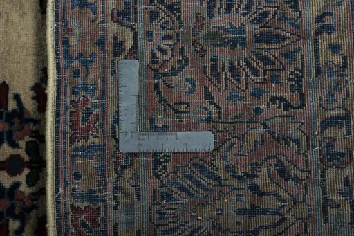 Backside of handmade 1930s Sarough rug showing knot structure and weave density