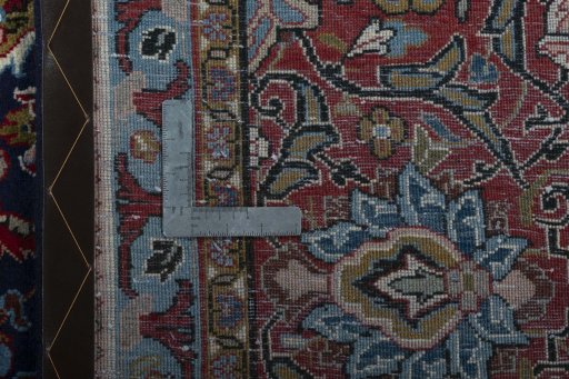 Backside of handmade 1970s Sarough rug showing knot structure and weave density