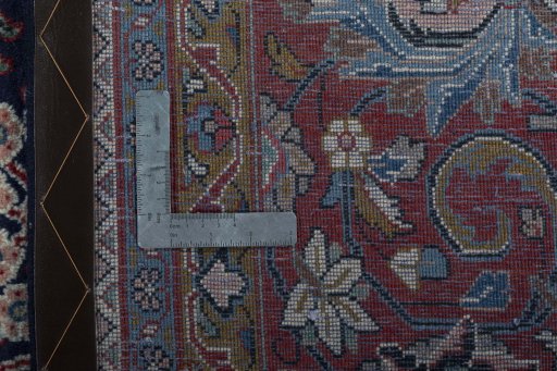 Backside of handmade 1970s Sarough rug showing knot structure and weave density