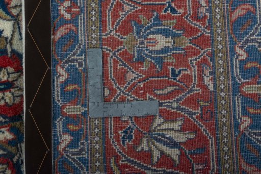 Backside of handmade New Sarough rug showing knot structure and weave density