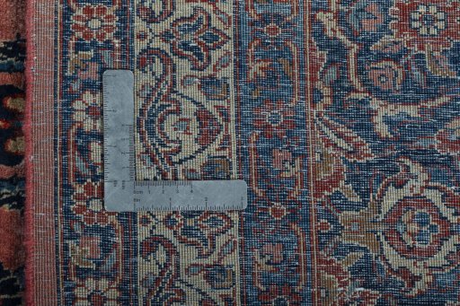 Backside of handmade 1930s Sarough rug showing knot structure and weave density