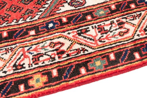 Backside of handmade 1970s Sarough rug showing knot structure and weave density