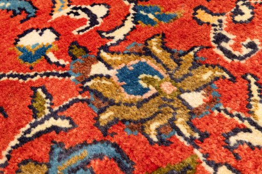 Backside of handmade New Sarough rug showing knot structure and weave density