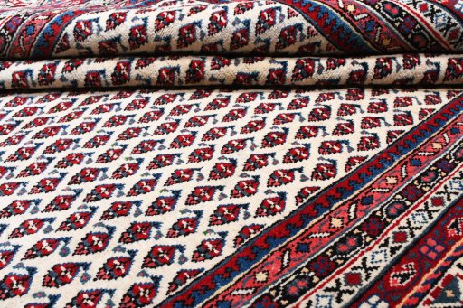 Close-up detail of 2000s Sarough Mir rug from Iran / Persia showing Wool weave