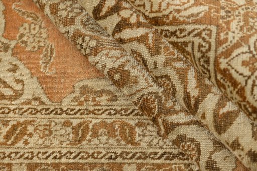 Corner detail of 1900s Tabriz rug showing border pattern and Wool pile