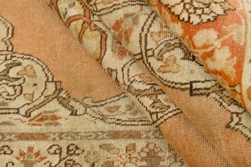 Corner detail of 1900s Tabriz rug showing border pattern and Wool pile