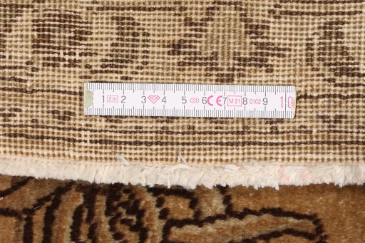 Corner detail of 1950s Tabriz rug showing border pattern and Wool pile