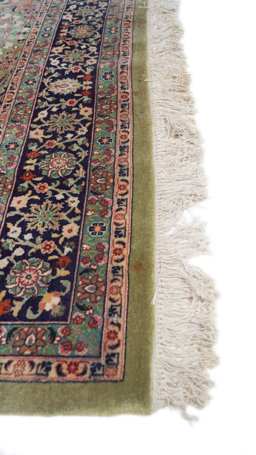 Corner detail of 1980s Tabriz rug showing border pattern and Wool pile