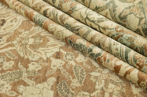 Corner detail of 1900s Tabriz rug showing border pattern and Wool pile
