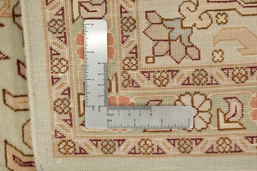 Corner detail of New Tabriz rug showing border pattern and Wool pile