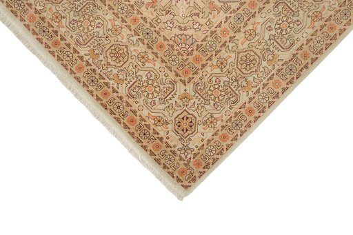 Backside of handmade New Tabriz rug showing knot structure and weave density