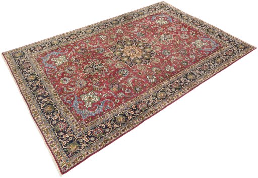 Corner detail of 1990s Tabriz rug showing border pattern and Wool pile