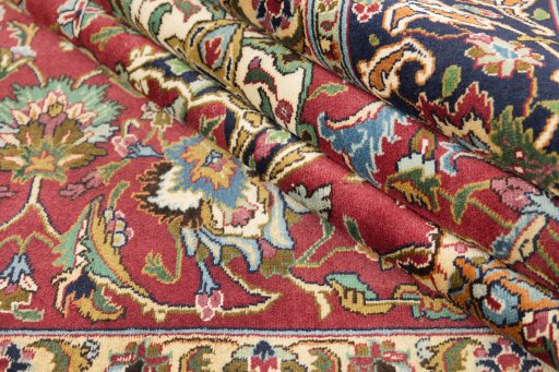 Close-up detail of 1990s Tabriz rug from Iran / Persia showing Wool weave