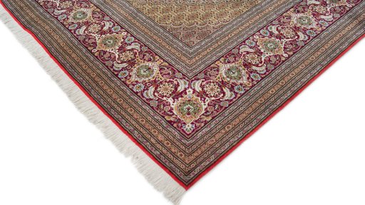 Backside of handmade New Tabriz rug showing knot structure and weave density