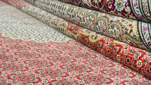 Close-up detail of New Tabriz rug from Iran / Persia showing Wool weave