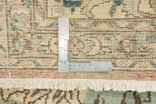 Corner detail of 1940s Tabriz rug showing border pattern and Wool pile