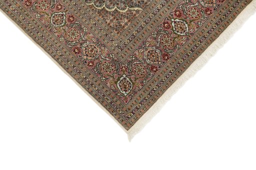 Backside of handmade New Tabriz rug showing knot structure and weave density