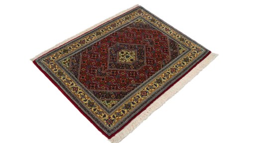 Corner detail of 1970s Tabriz rug showing border pattern and Wool pile