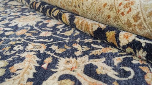 Close-up detail of New Tabriz rug from Iran / Persia showing Wool weave