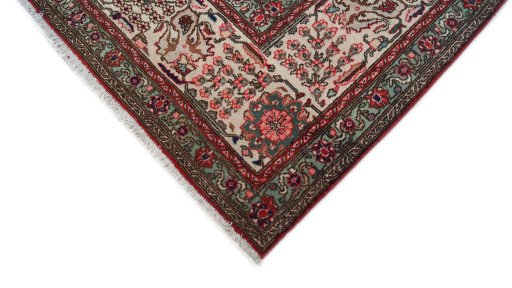 Backside of handmade 1950s Tabriz rug showing knot structure and weave density
