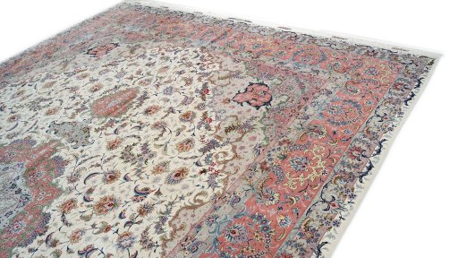 Backside of handmade 1990s Tabriz rug showing knot structure and weave density