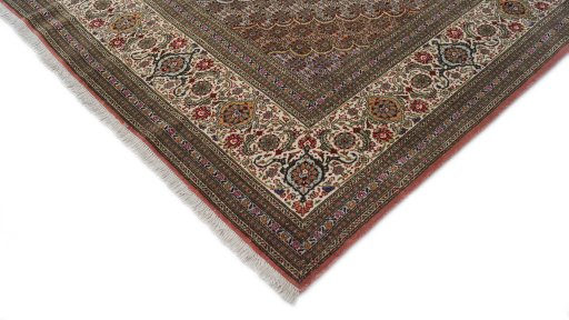 Backside of handmade 1990s Tabriz rug showing knot structure and weave density
