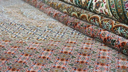 Close-up detail of 1990s Tabriz rug from Iran / Persia showing Wool weave