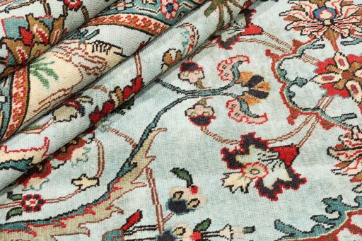 Corner detail of 1940s Tabriz rug showing border pattern and Wool pile