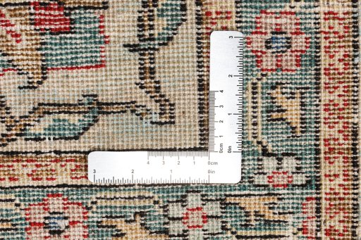 Surface texture of 1940s Tabriz rug with natural Wool and intricate pattern