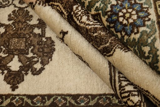 Corner detail of 1920s Tabriz rug showing border pattern and Wool pile
