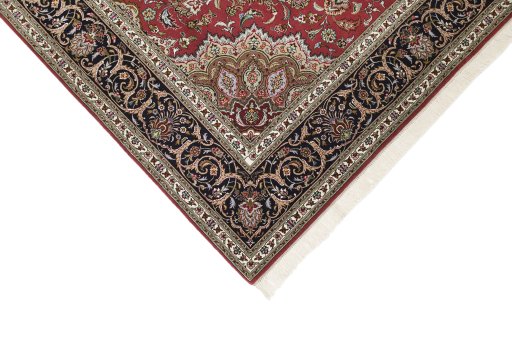 Backside of handmade 1990s Tabriz rug showing knot structure and weave density