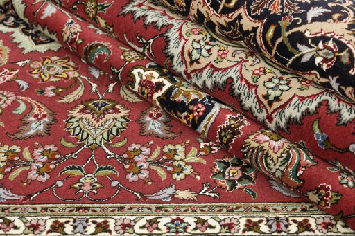 Close-up detail of 1990s Tabriz rug from Iran / Persia showing Wool weave