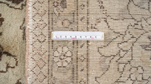 Corner detail of 1960s Tabriz rug showing border pattern and Wool pile
