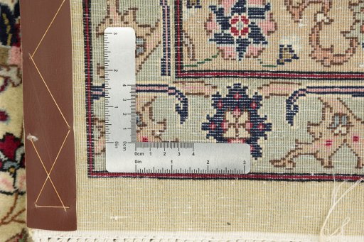 Surface texture of 1960s Tabriz rug with natural Wool and intricate pattern