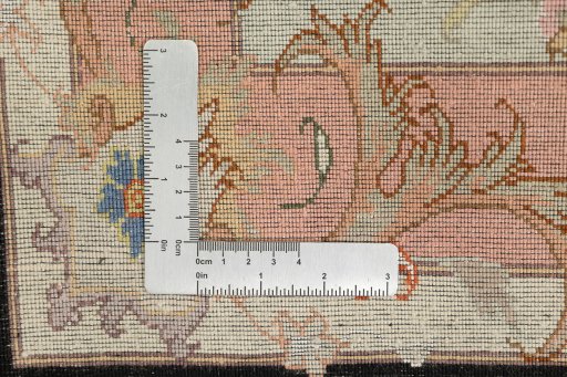 Close-up detail of New Tabriz rug from Iran / Persia showing Wool weave