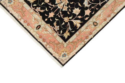 Backside of handmade New Tabriz rug showing knot structure and weave density