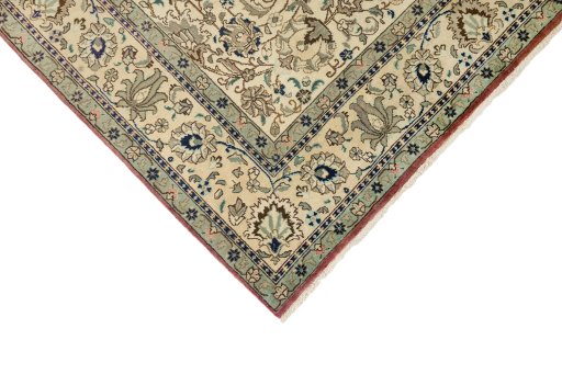 Backside of handmade New Tabriz rug showing knot structure and weave density