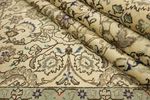 Close-up detail of New Tabriz rug from Iran / Persia showing Wool weave