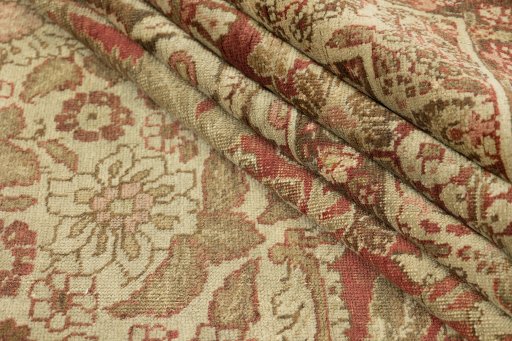 Corner detail of 1900s Tabriz rug showing border pattern and Wool pile