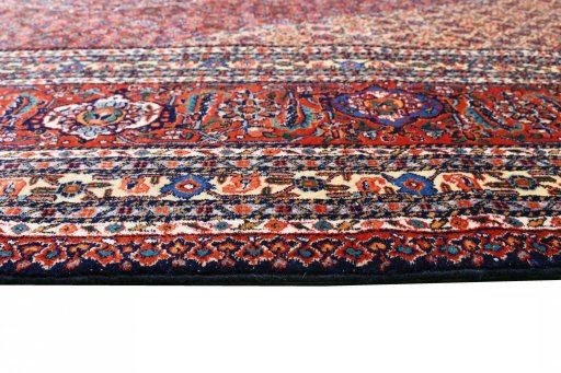 Corner detail of 1970s Tabriz rug showing border pattern and Wool pile