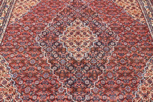 Full view of 1970s Tabriz rug from Iran / Persia, 341 × 255 cm in Red tones