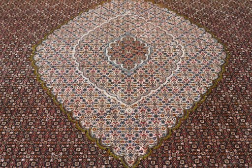 Surface texture of 2000s Tabriz rug with natural Cork and intricate pattern