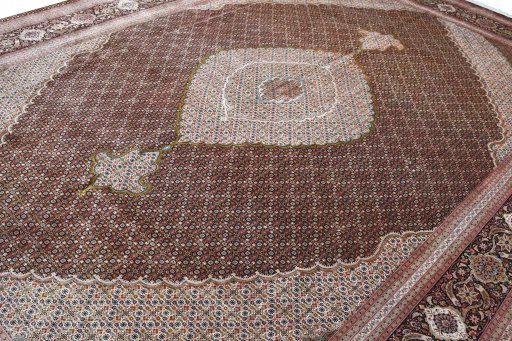 Backside of handmade 2000s Tabriz rug showing knot structure and weave density